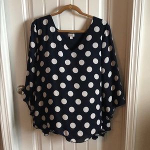 Navy blue and white polka dot blouse